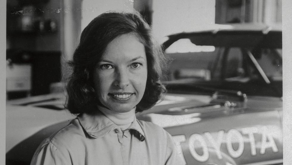 janet guthrie stooping with helmet