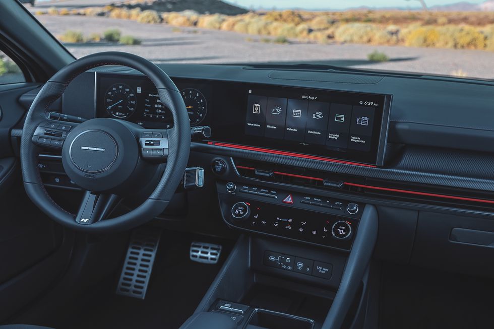 2024 hyundai sonata n line interior with big screens and black leather steering wheel