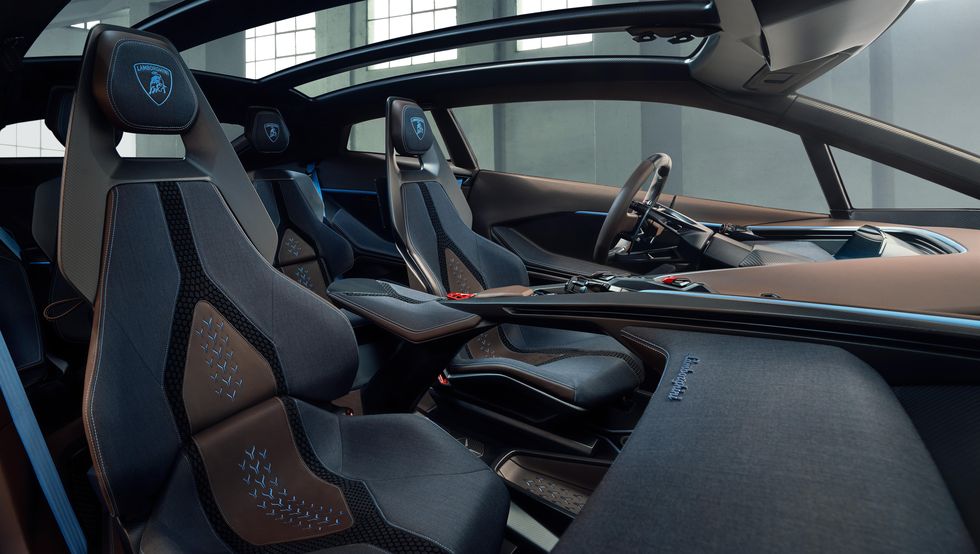 2028 lamborghini lanzador interior in blue paint and grey nylon with studio photography background behind it