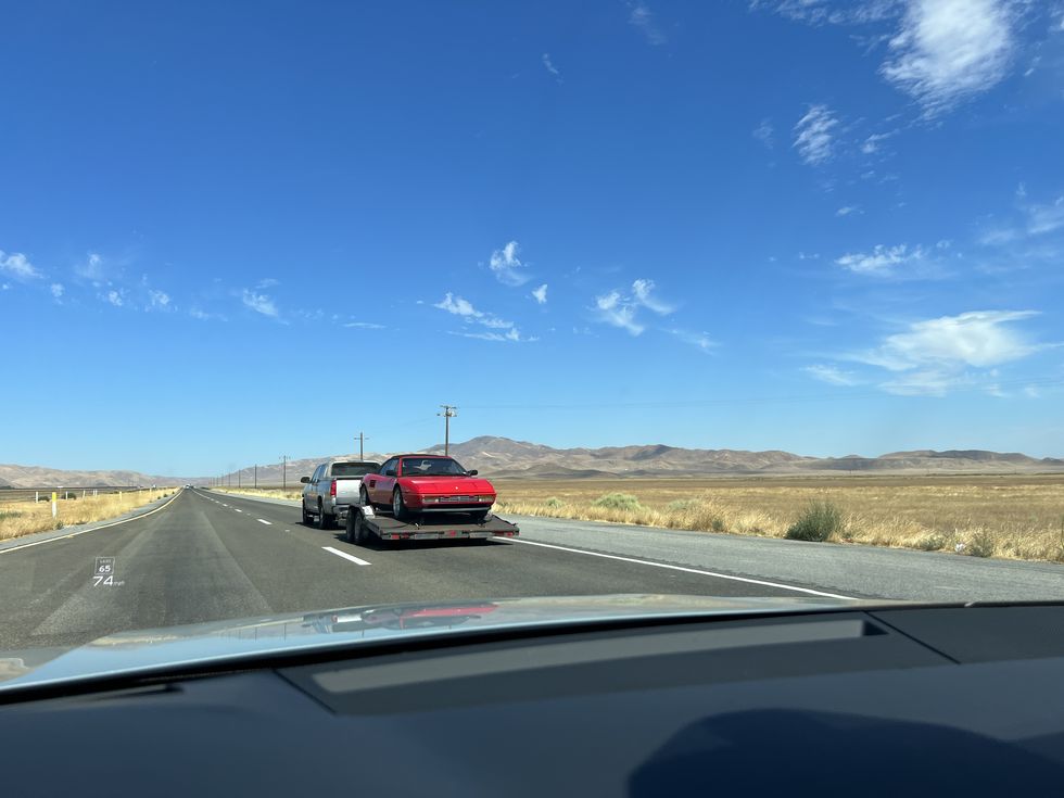 car being transported pebble beach 2023