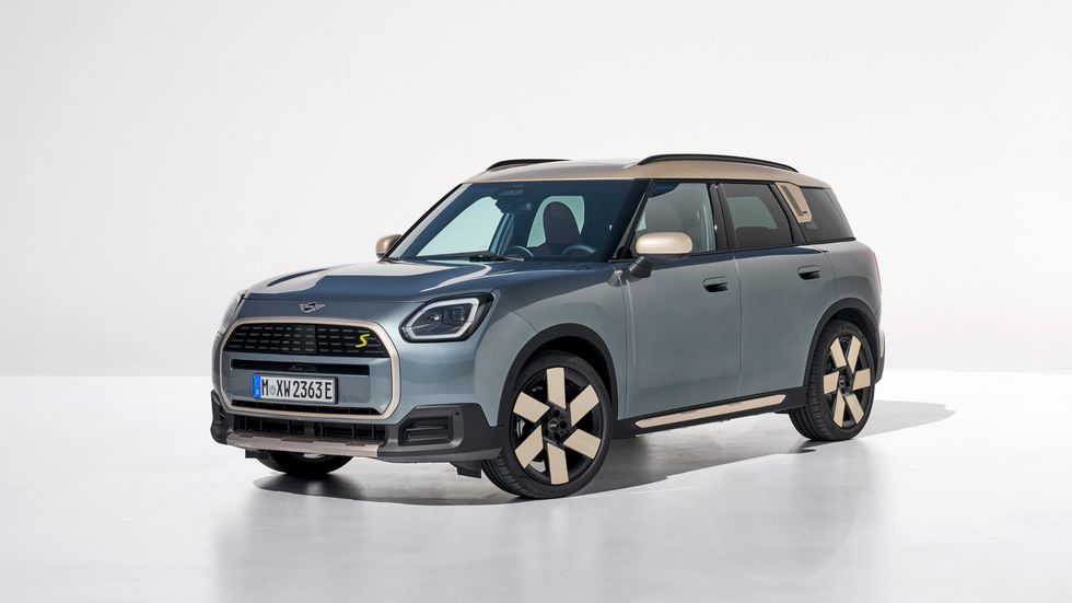 2025 mini cooper countryman electric in light blue with a cream and black interior