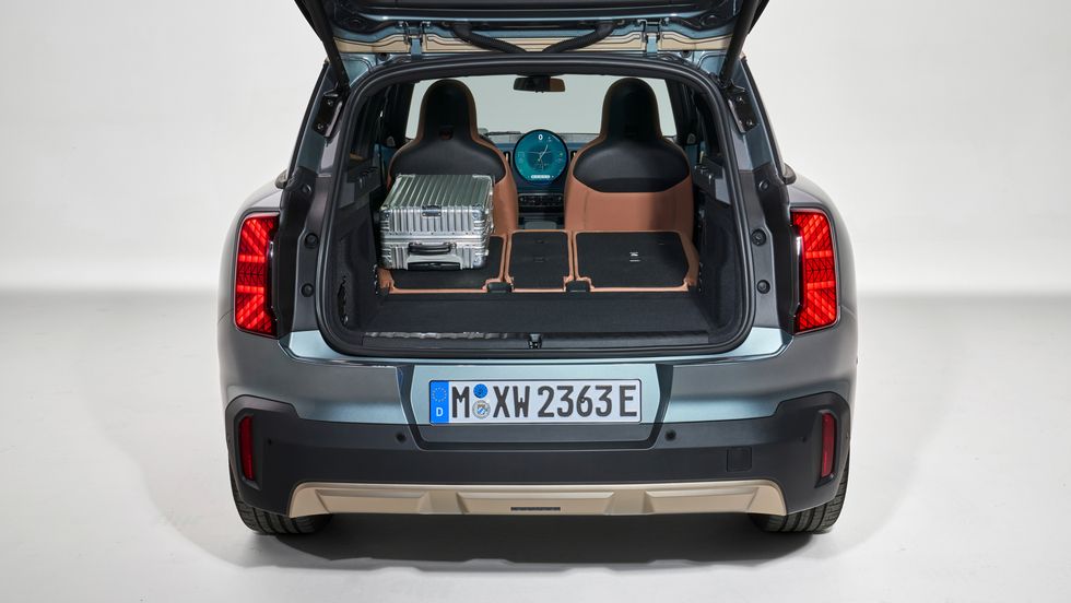 2025 mini cooper countryman electric in light blue with a cream and black interior